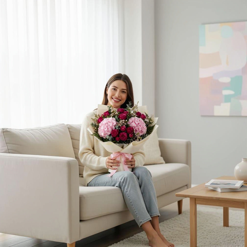 Women’s Day Soft Pink Hydrangea & Baby Rose Bouquet held by a model, view 3