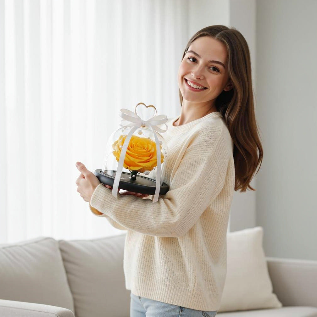 Yellow Small Preserved Rose held by a model, view 1