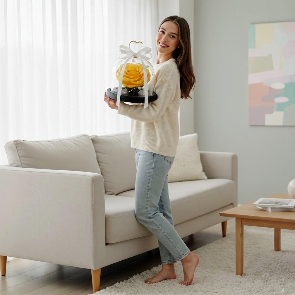 Yellow Small Preserved Rose held by a model, view 2